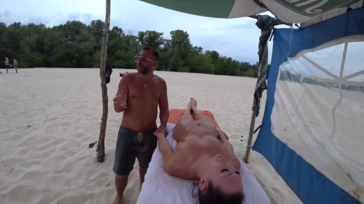 Public Beach Girl Gets a Nude Massage